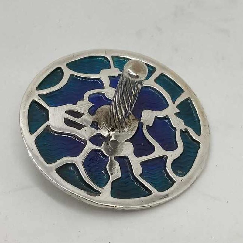 Handmade sterling silver Hanukah Dreidel Enameled Blue and green contemporary cut out designs. Dimension diameter 3.6 cm X 2.3 cm.