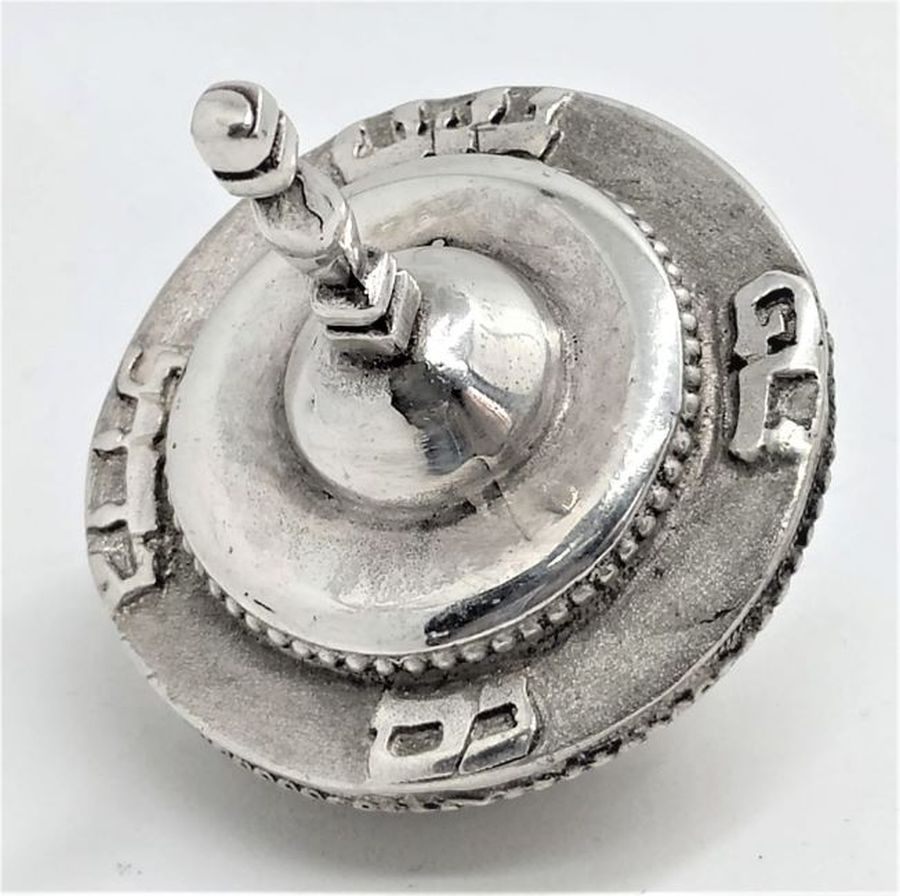Handmade Hanukah Dreidel Sevivon Round traditional shape with full Hebrew words " Great miracle happened here". Dimension diameter 3.2 cm X 4.5 cm.