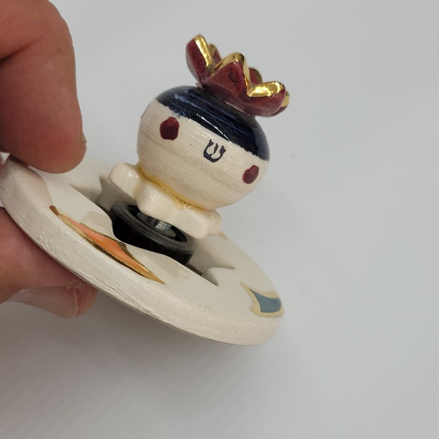 Hanukah Dreidel Ceramic Pomegranate Sevivon handmade. Grebler the ceramicist designed this spinning pomegranate on a hinge easy for easy spinning.