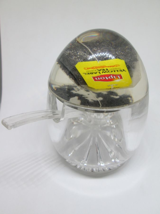 RoshHashana honey dish Perspex with a sugar cube and tea bag in Perspex cover. Dimension diameter 8.8 cm X 11.2 cm approximately.