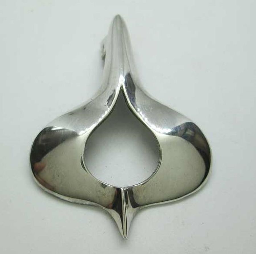 Handmade sterling silver pendant contemporary design smooth shiny silver design. Dimension 3.9 cm X 5.3 cm approximately.
