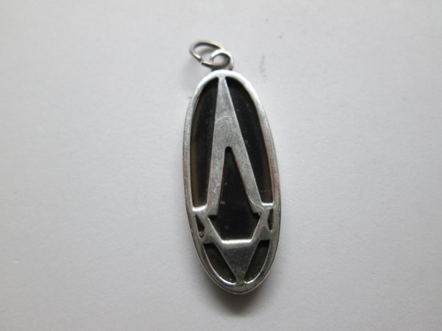 A modern design elongated Magen David Star Pendant Onyx oval shape sterling silver pendant. Dimension 1.2 cm X 3.3 cm approximately.