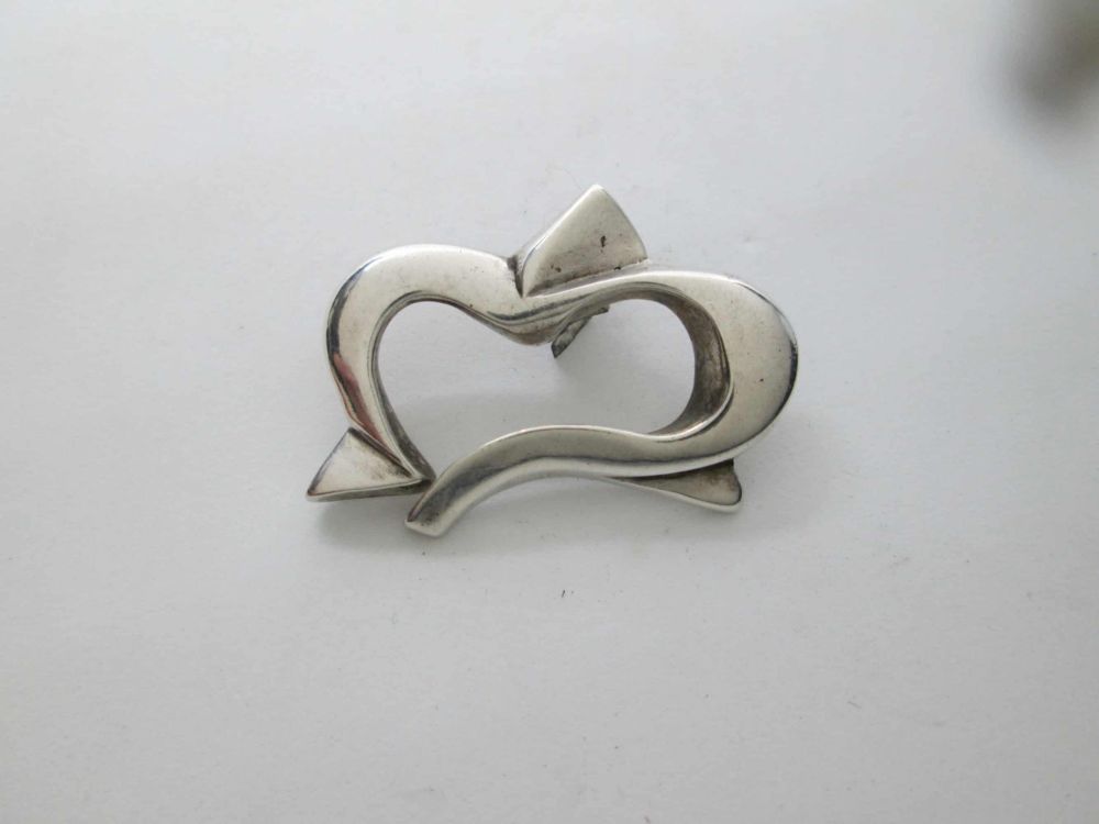 Sterling Silver Magen David Star Pendant Heart Handmade sterling silver contemporary abstract star of David with heart shape smooth silver.