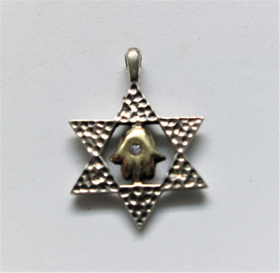 Sterling silver and 14 carat gold Magen David Star Pendant Hamsa set with white Zirconia stone. Dimension 1.8 cm X 2.4 cm approximately.