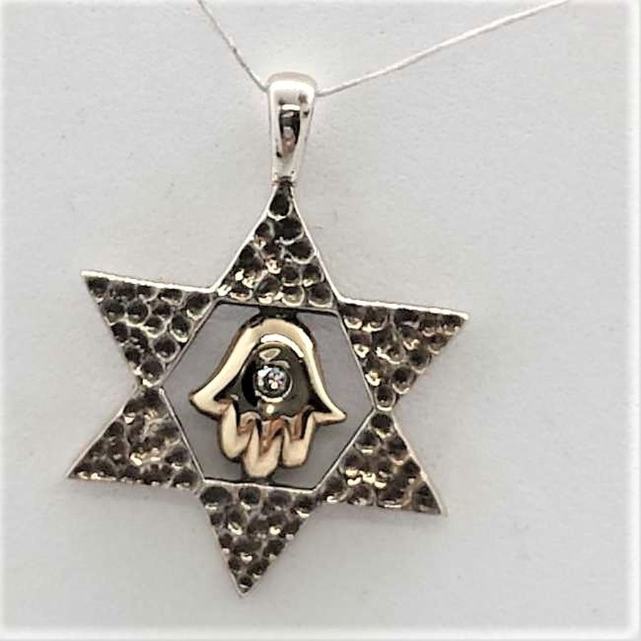 Sterling silver and 14 carat gold Magen David Star Pendant Hamsa set with white Zirconia stone. Dimension 1.8 cm X 2.4 cm approximately.
