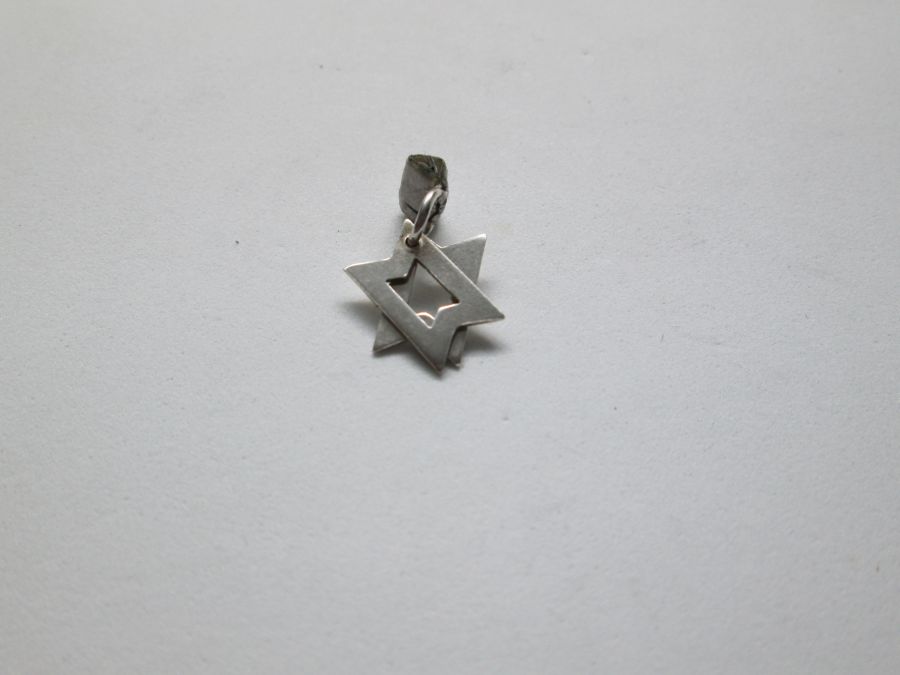 Handmade sterling silver David Star Mini Mobile 2 parts small size. Once hung on chain ,it shapes Star of David. Dimension 1.8 cm X 1.25 cm.