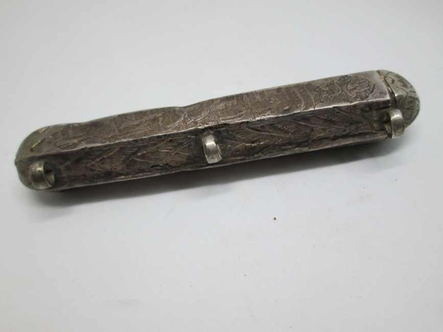An antique Muslim silver amulet case vintage with Islam phrase quoted from the Korean to bless person carrying it 8.1 cm X 1.8 cm X 1.5 cm approximately.