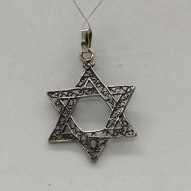Sterling Silver Magen David Star Pendant Yemenite Filigree Classic fine filigree and oxidized so to give a nice antique look. Dimension 2.6 cm X 3.5 cm X 0.1 cm approximately. One can find a wide variety of star of David pendants in silver , gold and other cheaper materials. There are designs for women ,men and children different sizes to suit every desire. Star of David is known in Hebrew Magen David or the Shield of David is a generally recognized symbol of modern Jewish identity and Judaism. Its shape is made by 2 triangles forming a hexagram, combination of two equilateral triangles. The star of David has been adapted into a variety of many culture, but in different meanings. Nowadays it is symbolizing the state of Israel's flag since the first Zionist congress in 1897. Before that it was used in Christianity to decorate churches in medieval time. Only later 19th century it has been used by eastern European Jewish communities as their Jewish symbol. The Zohar (Kabbalah) gives a spiritual explanation as for the star of David triangles. The first triangle has the connection of G-D , Torah and The sons of Israel. The second triangle is reflected by G-D , the study of Torah and the study of the Zohar. By doing these learning the Torah and the Zohar you approach yourself to G-D. The fact that in a triangle each of The three corners of the triangles are connected with each other . It demonstrates that the Jewish soul is itself knotted to G‑d Through the Torah study and observance. By that connection between the Jew and G‑d and the Torah study it merely brings it to light. Visit my eBay site :PENDANT STERLING SILVER STAR OF DAVID PENDANT MASCULINE HEAVY LOOK Facebook connection : Y.Sh.Ghatan & Sons For gold Star of David :Star of David Gold Pendants