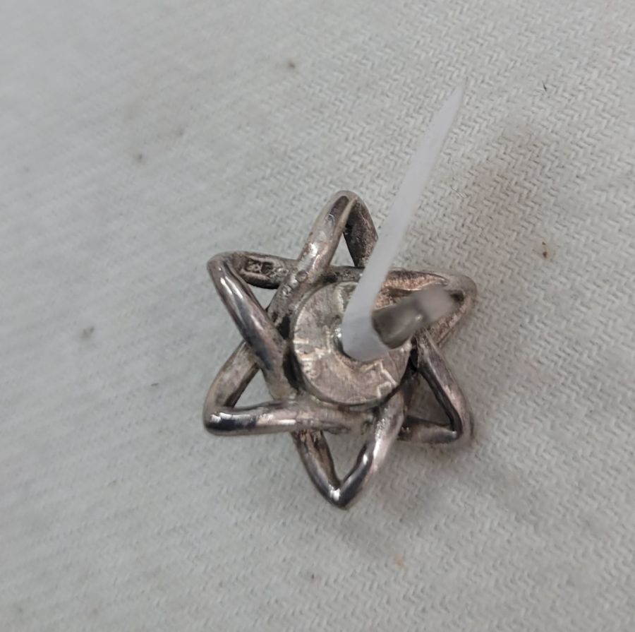 Chanukah Sevivon Tiny Star of David shape three dimension made by S. Ghatan (Katan). Dimension 2.35 cm X 1.85 cm X 1.85 cm approximately.