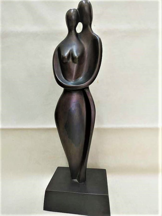 Bronze Sculpture Loving Couple. Handmade bronze sculpture loving couple standing together handmade by D. Jaron 8 cm X 10.5 cm X 31 cm.