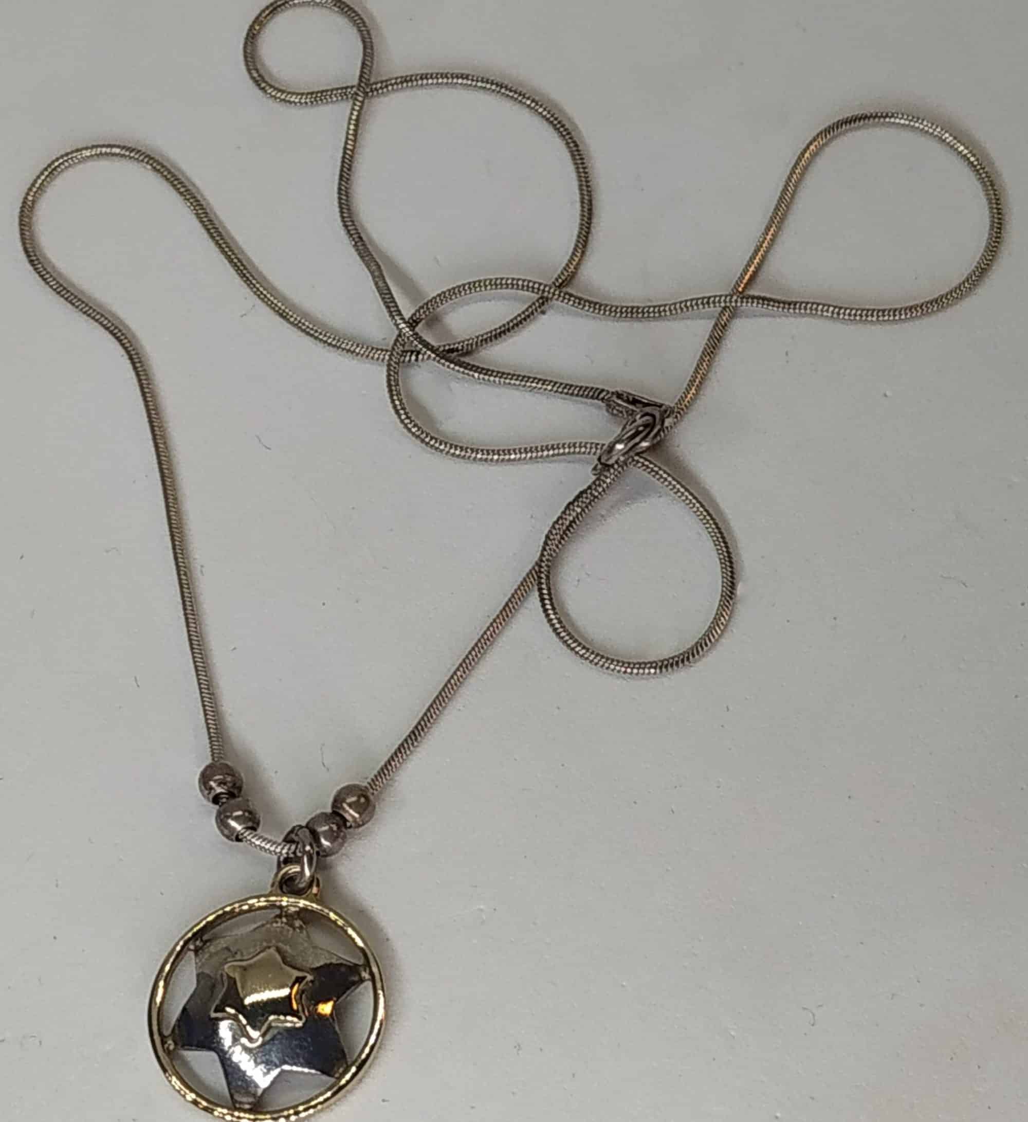Silver Magen David Star Pendant Gold Frame handmade contemporary star with chain. The jeweler has added gold frame around the gold and silver star.
