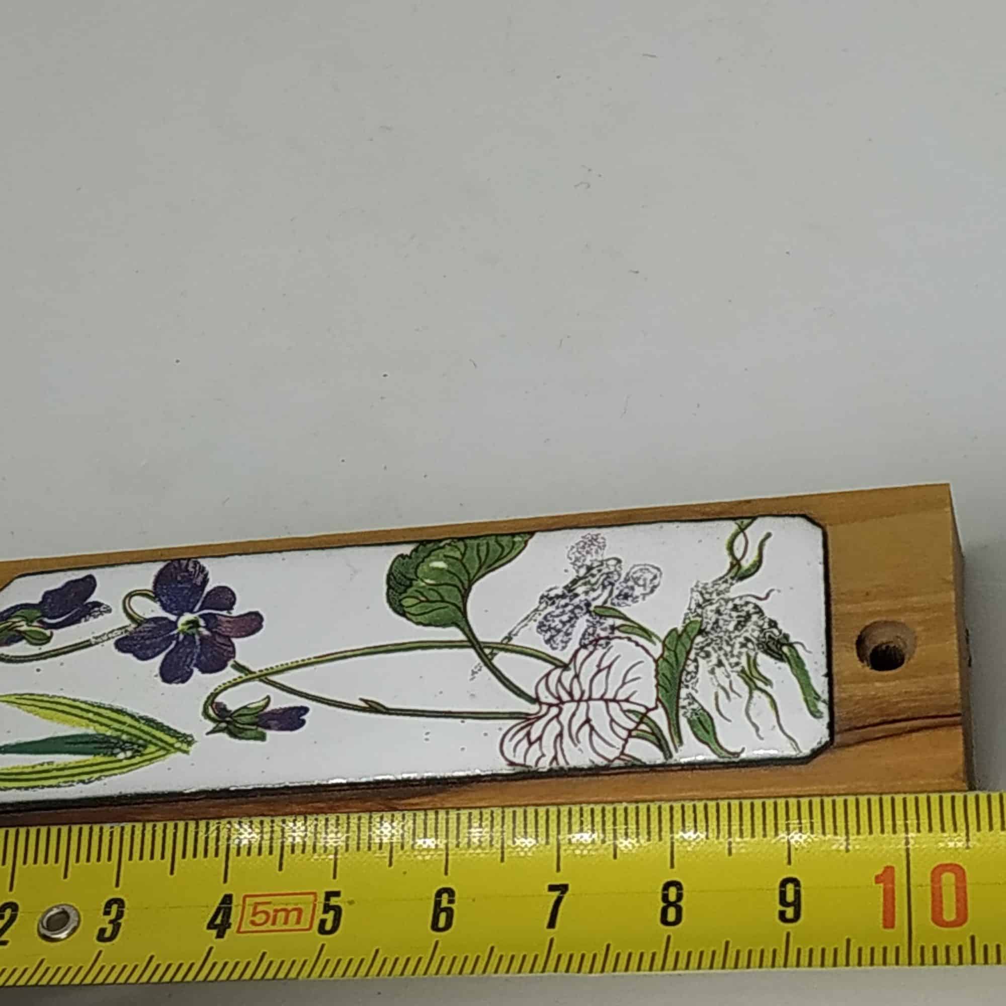 Olive Wood Mezuzah Violet Flowers Enameled handmade. Olive wood Mezuzah with hand painted violet flowers on enamel. Suitable for parchments up to 7.5 cm.
