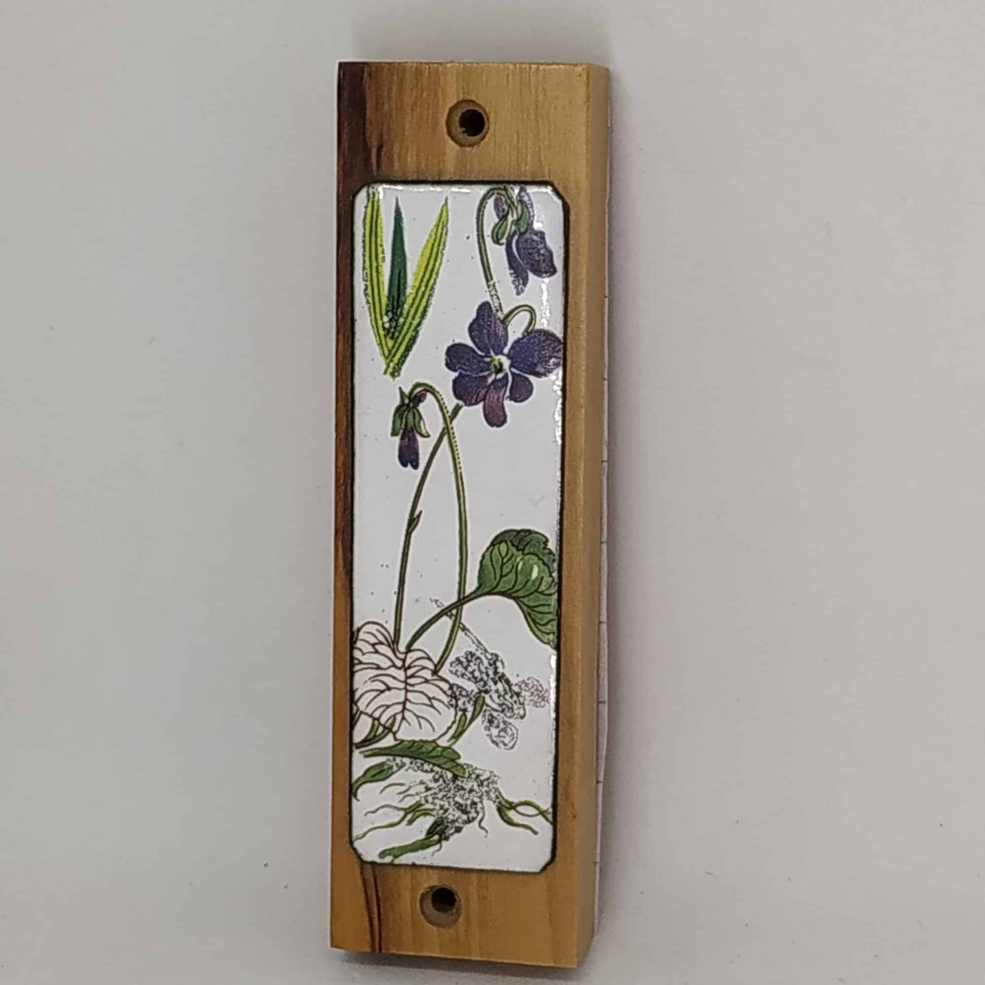 Olive Wood Mezuzah Violet Flowers Enameled handmade. Olive wood Mezuzah with hand painted violet flowers on enamel. Suitable for parchments up to 7.5 cm.