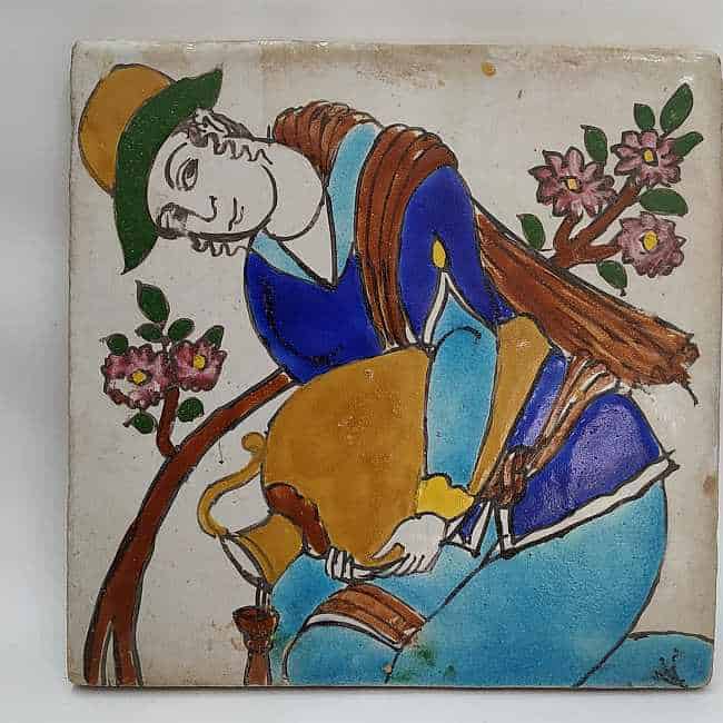 Vintage Ceramic Tile Woman handmade. A middle East nomadic woman pouring water to a plant with typical robe. Dimension 20.2 cm X 20.2 cm approximately.
