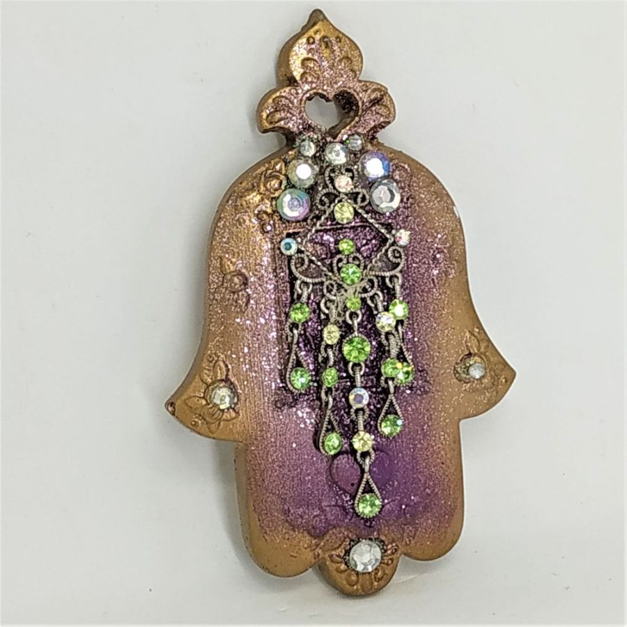 Ceramic Hamsa Crystal Stones set on it. The artist has made this rich looking hamsa from hard clay and has set on it crystal stones.