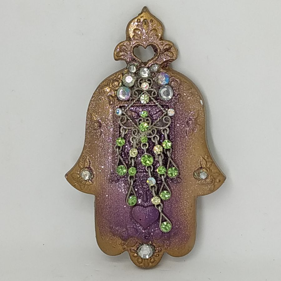 Ceramic Hamsa Crystal Stones set on it. The artist has made this rich looking hamsa from hard clay and has set on it crystal stones.