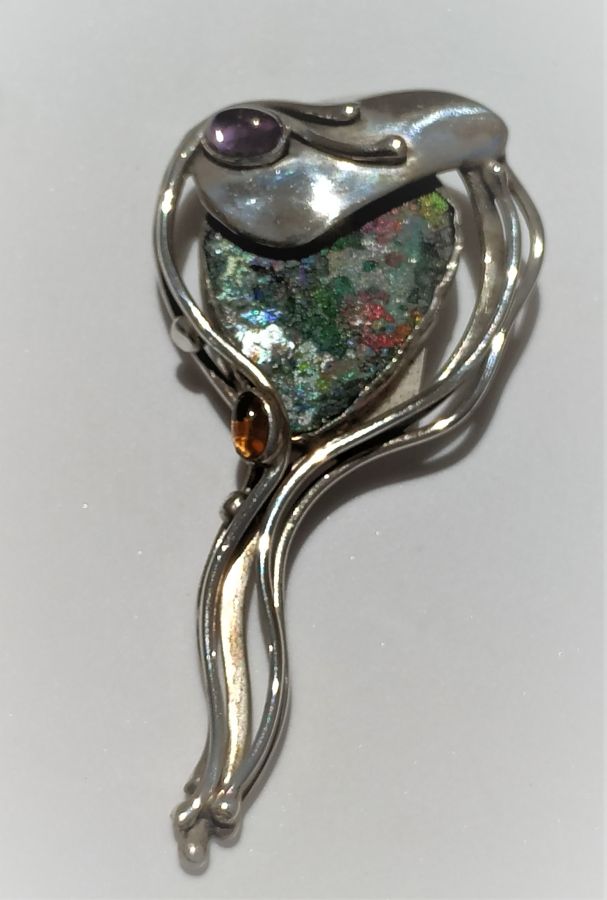 Roman Glass Silver Pendant and can be used as a pin as well , handmade by Y. Perez. Dimension 3.4 cm X 7.1 cm X 1 cm approximately.