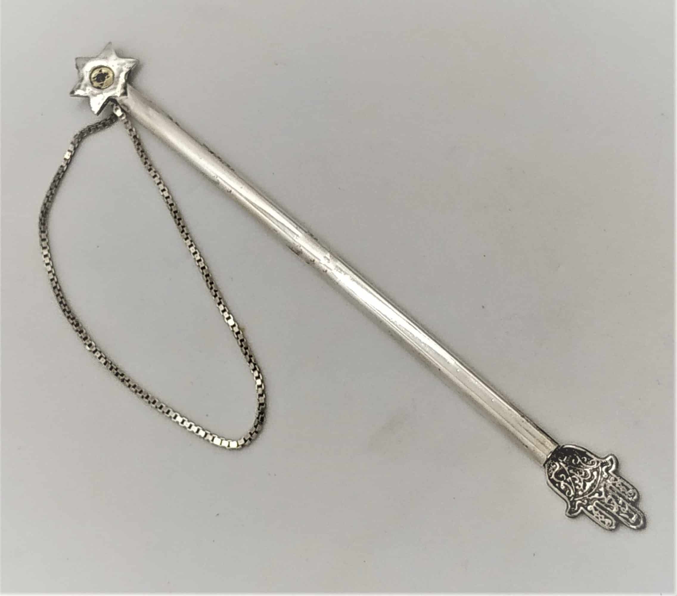 Silver Gold Torah Pointer handmade by Samy Ghatan Katan and set with a garnet stone . Dimension 12.8 cm X 1 cm approximately.