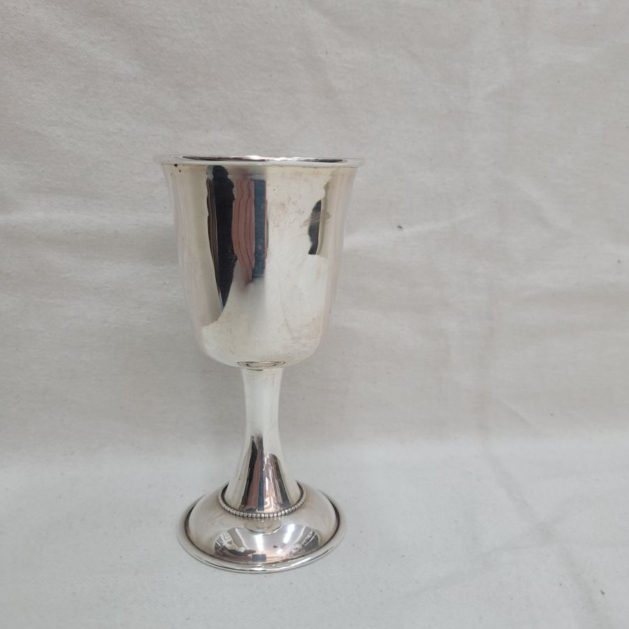 Sterling silver Kiddush goblet smooth clean design with small silver dots line soldered around cup. Dimension diameter 7 cm X 13 cm approximately.