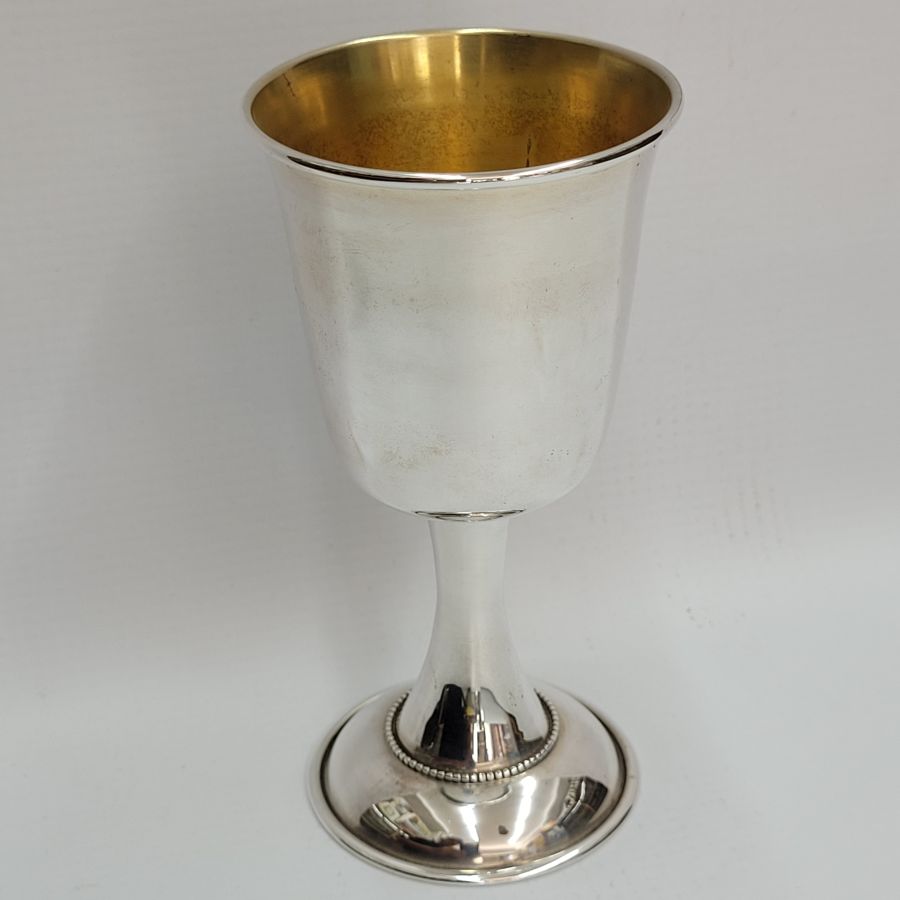 Sterling silver Kiddush goblet smooth clean design with small silver dots line soldered around cup. Dimension diameter 7 cm X 13 cm approximately.