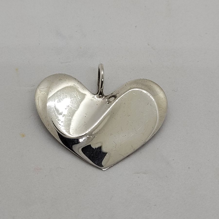 Sterling silver pendant smooth modern heart contemporary heart shape made with two parts attached by love. Dimension 3.4 cm X 2.9 cm approximately.