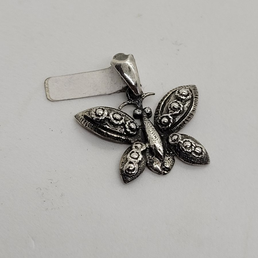 Handmade butterfly sterling silver pendant three dimension forming a butterfly. Dimension butterfly 2.3 cm X 2.3 cm X 0.3 cm approximately.