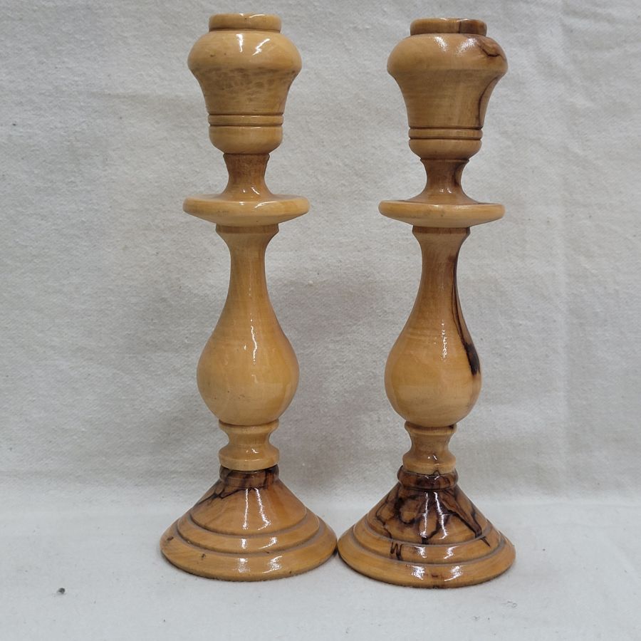 Handmade natural olive wood Sabbath candlesticks, where one can see the olive wood deigns made by age of wood diameter 5.6 cm X 16 cm approximately.