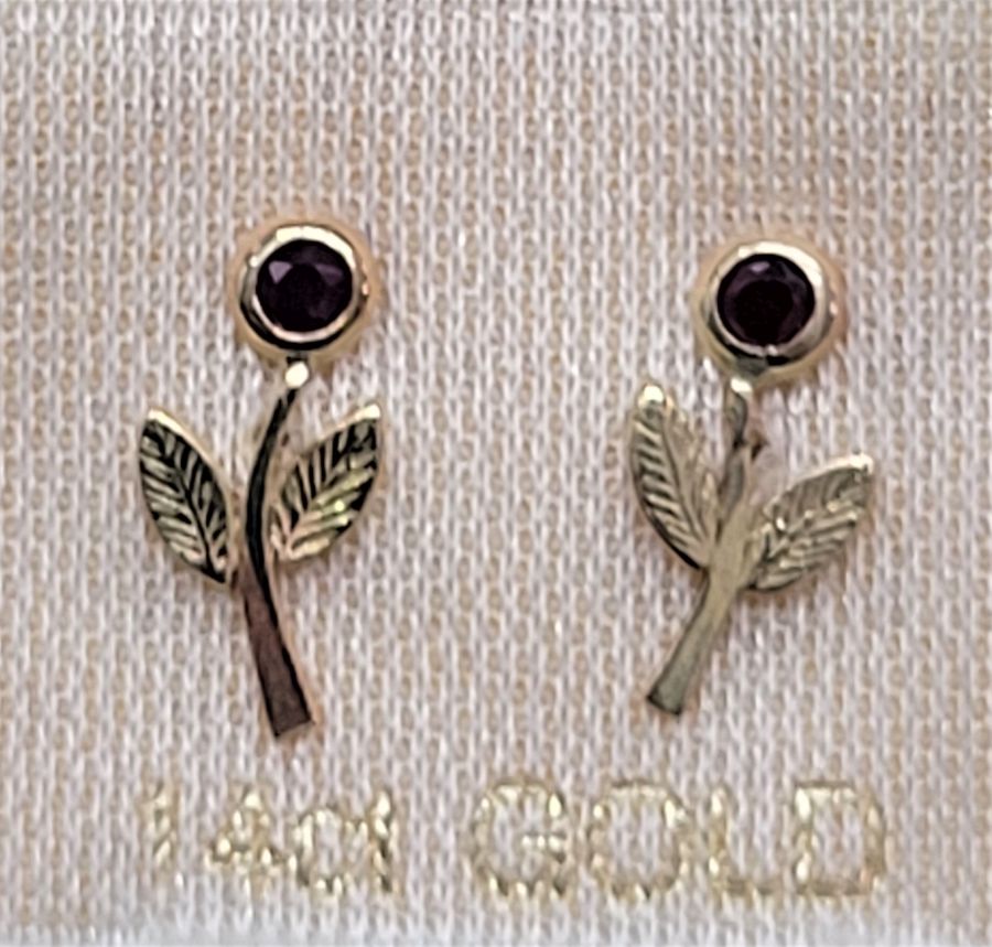 Handmade 14 carat gold flower stud earrings set with genuine faceted two Rubies. Dimension 1 cm X 1.2 cm approximately.