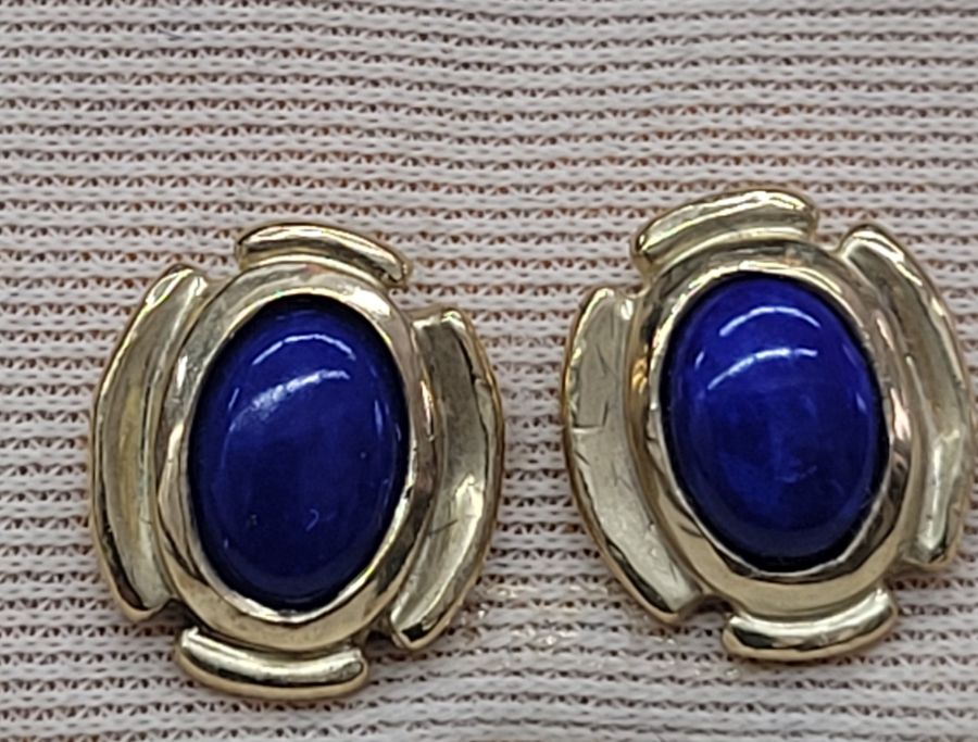 Handmade 14 carat gold stud earrings Lapis Lazuli stones set with oval cabochon Lapis Lazuli stones. Dimension 0.7 cm X 0.5 cm approximately.