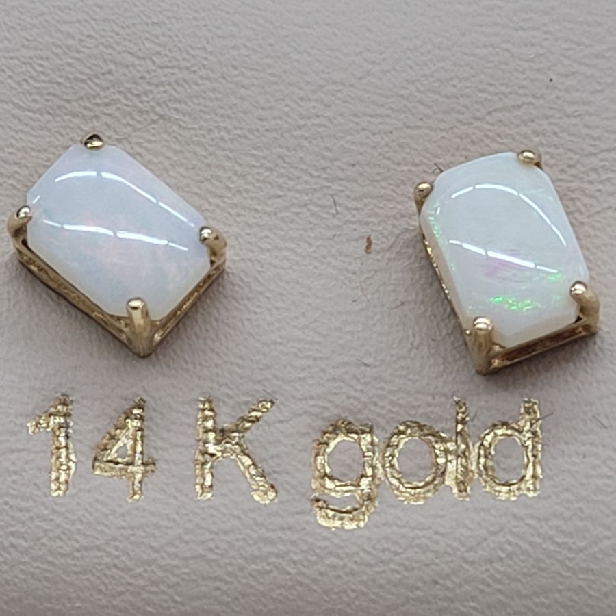 Handmade 14 carat gold cabochon Opal stud earrings set with two cabochon fire Opal stones handmade. Dimension 0.5 cm X 0.7 cm approximately.