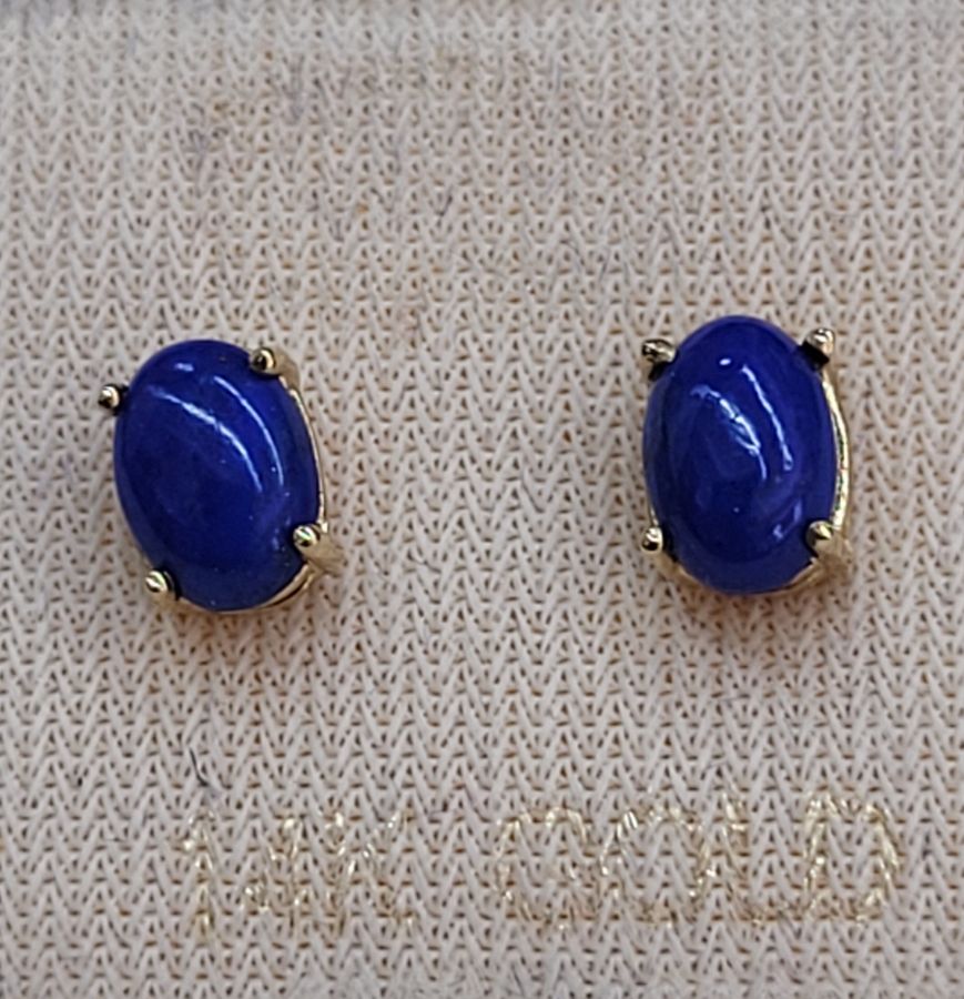 Handmade 14 carat gold cabochon Lapis Lazuli stud earrings set with two cabochon deep blue stones handmade. Dimension 0.4 cm X 0.6 cm approximately.