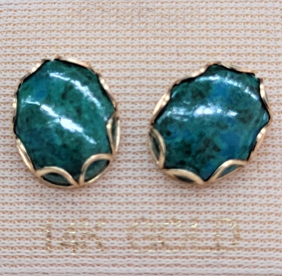 Handmade 14 carat gold Elat stone stud earrings set with oval cabochon Elat stones in a designed setting with fence shape prongs.