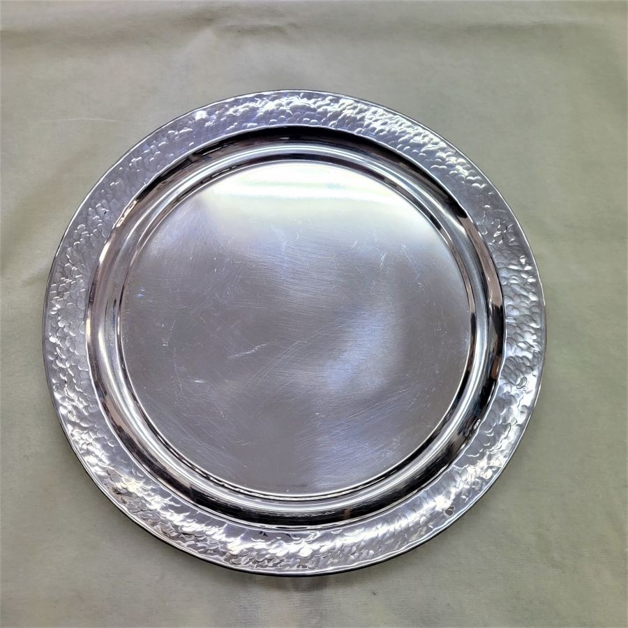 Handmade sterling silver hammered Kiddush Cup Saucer made in Israel. Dimension diameter 22 cm X inside saucer diameter 16 cm approximately.