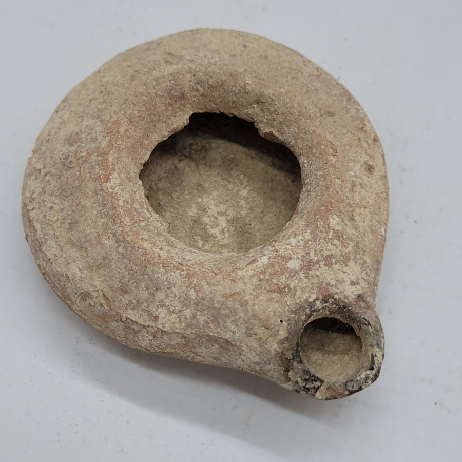 Antique round Herodian oil lamp 1st century, early King Herod era found in the Holy Land of Israel 1st century CE. Dimension 8.5 cm X 7 cm X 2 cm.