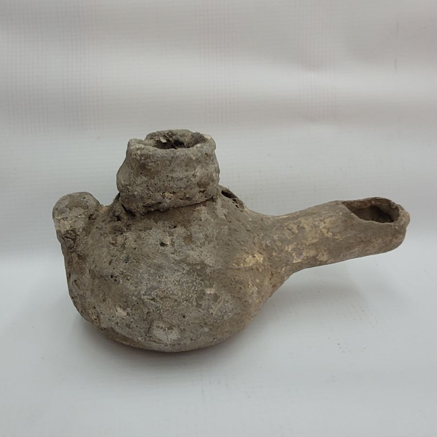 Genuine antique Roman pottery oil lamp early Roman Era era. It is from private collection. Dimension 7.5 cm X 15 cm X 7 cm approximately.