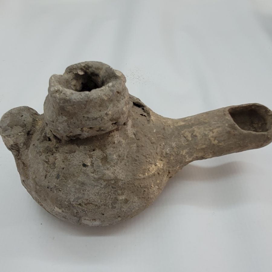 Genuine antique Roman pottery oil lamp early Roman Era era. It is from private collection. Dimension 7.5 cm X 15 cm X 7 cm approximately.