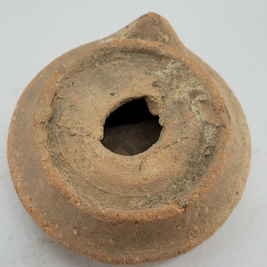 Genuine antique round Roman oil lamp early Roman era. It is from private collection. Dimension 7.5 cm X 15 cm X 7 cm approximately.