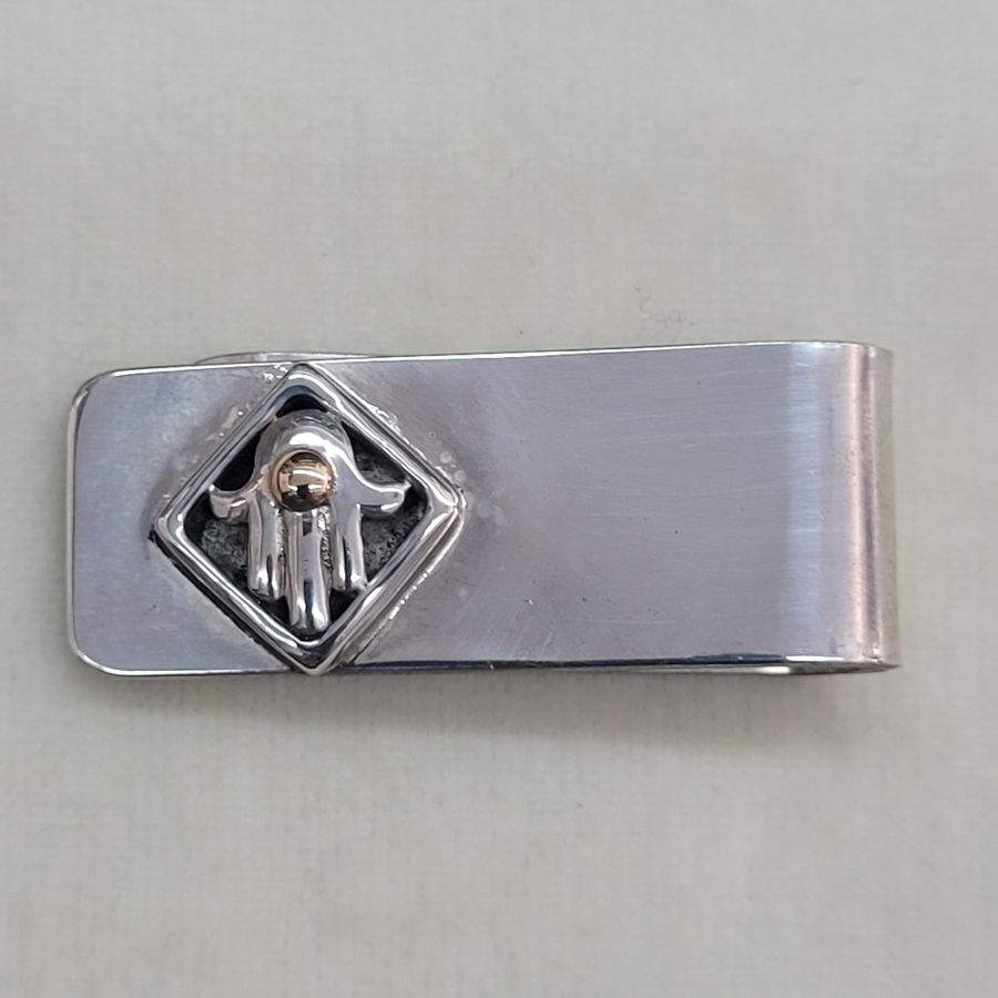 Handmade sterling silver Hamsa money holder in a square frame and a gold dot on top of Hamsa. Handmade by S. Ghatan. Katan.