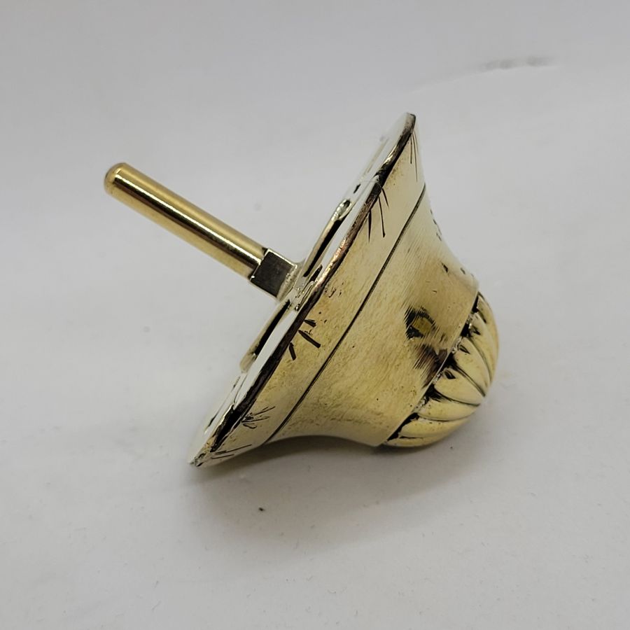 An original and one of a kind Brass Dreidel Sevivon contemporary design made by S. Ghatan Katan from Jerusalem diameter 5.8 cm X 6.9 cm approximately.