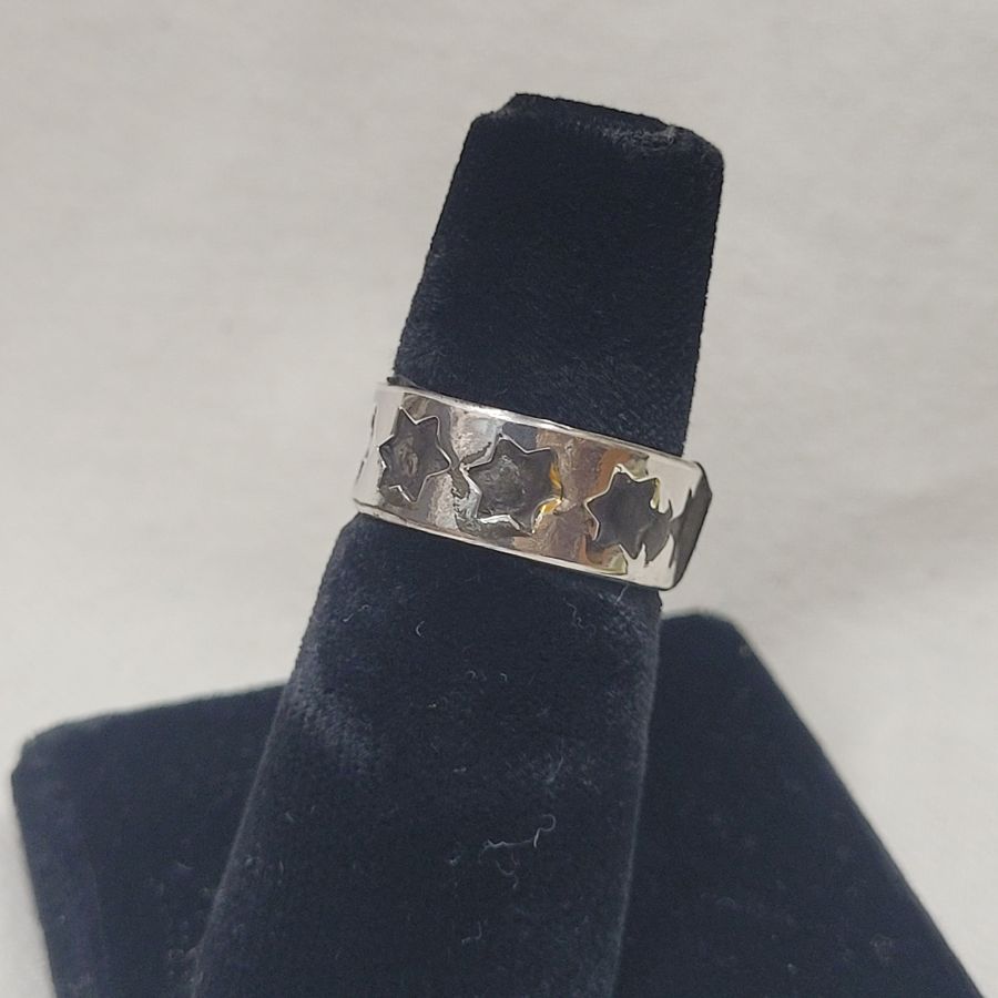 Handmade sterling silver David stars band ring with many stars adjustable suitable for any finger size . Dimension 0.7 cm approximately.