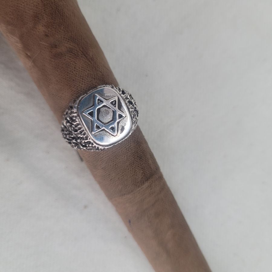 Handmade sterling silver ring Magen David star rough masculine design suitable for man finger. Dimension 1 cm X 1.5 cm approximately.