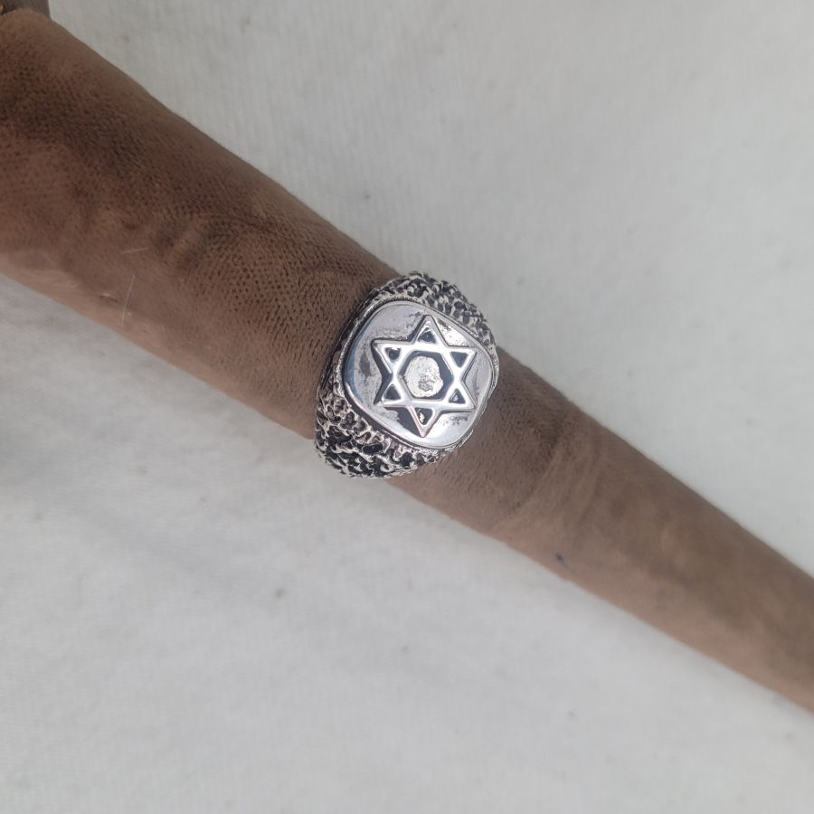 Handmade sterling silver ring Magen David star rough masculine design suitable for man finger. Dimension 1 cm X 1.5 cm approximately.