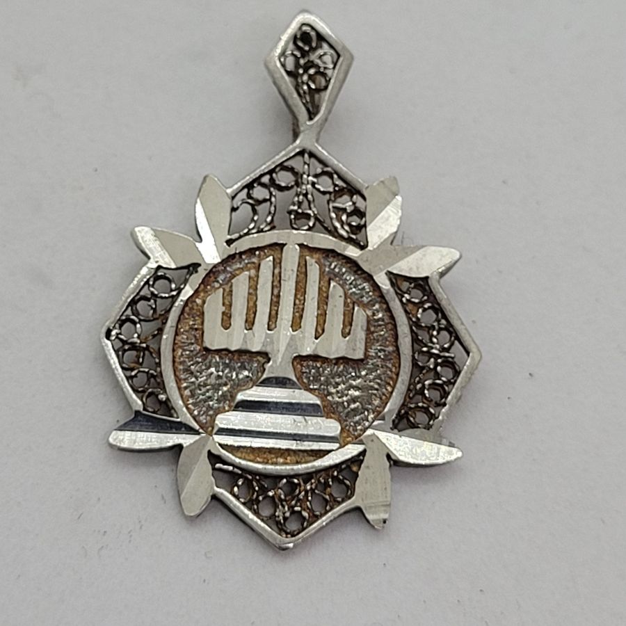Handmade sterling silver Yemenite filigree Menorah pendant diamond shape, and diamond cut finish for a sparkling look 3.2 cm X 2.2 cm approximately.