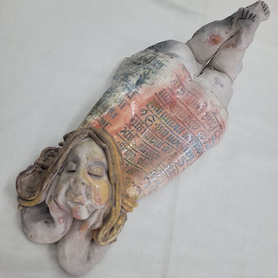 Handmade glazed Roku ceramic sculpture princess lying and dreaming of her charming prince made by S. Factor 30.5 cm X 10 cm X 12 cm approximately.