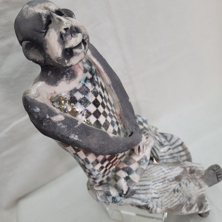 Handmade glazed ceramic Harlequin Roku ceramic statue sitting made by S. Factor. It is supposed to sit on a shelf side 29.5 cm X 10 cm X 12 cm.