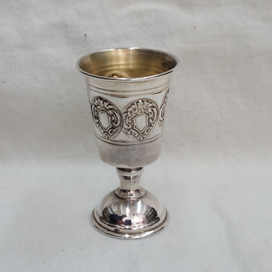 Handmade sterling silver Schnapps cup embossed design, with embossed designs all around cup. Dimension diameter 4 cm X 7 cm approximately.