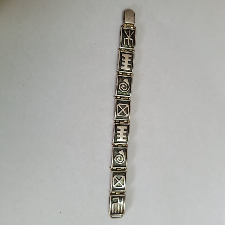 Handmade contemporary designed sterling silver abstract heavy silver bracelet solid, with unusual characteristic designs on each silver bracelet link.