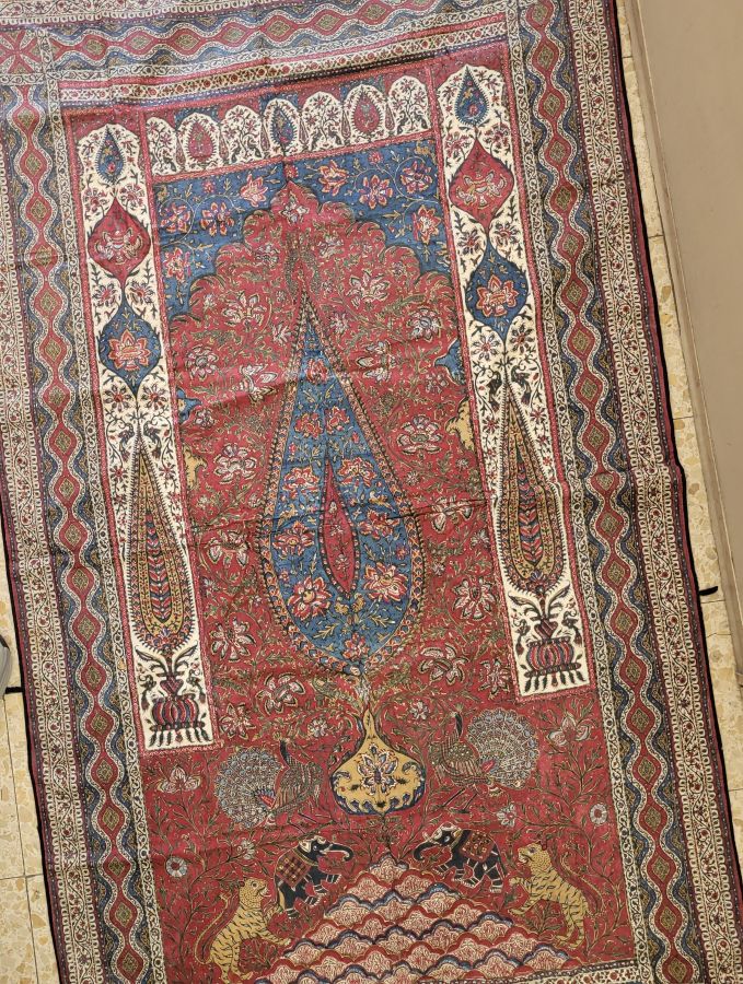 Handmade Ghalam Kalamkari 19th century, printed cotton with natural colors made by vegetables & fruits, in prayer design having cypress trees and peacocks.
