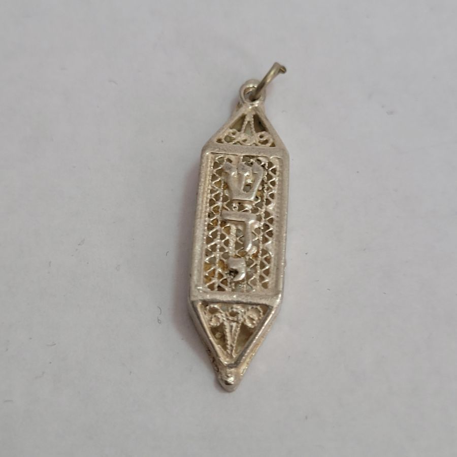 Handmade sterling silver hexagon Mezuzah Yemenite Filigree pendant with raised letters Shaddai ( G-D) in Hebrew, 1 cm X 0.4 cm X 3.7 cm approximately.