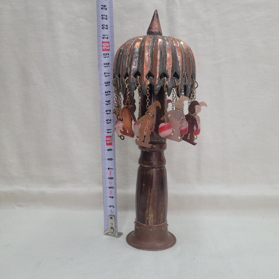 The engravings on vintage Purim copper and wood Grogger are handmade & hammered copper saying in Hebrew the names of Hamman's 10 sons hung on a high tree.